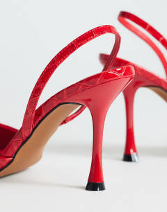Model wearing Angel heeled court shoe in patent red croc