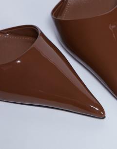 Model wearing Angel heeled court shoe in tan patent