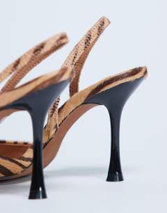 Model wearing Angel heeled court shoe in tiger print hair on real leather 