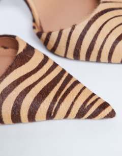 Model wearing Angel heeled court shoe in tiger print hair on real leather 