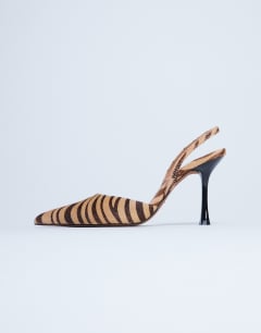 Model wearing Angel high heeled court shoe in tiger print hair on real leather