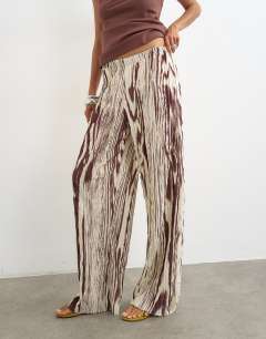 Model wearing Animal plisse wide leg trouser in brown