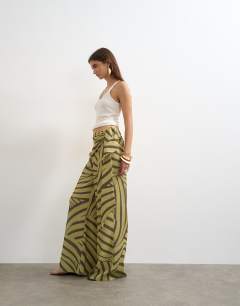 Model wearing Animal plisse wrap scarf detail trousers in green