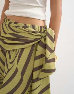Model wearing Animal plisse wrap scarf detail trousers in green