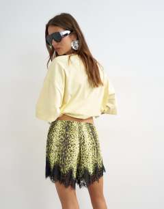 Model wearing Animal print lace trim shorts in multi