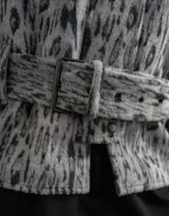 Model wearing Animal printed wool blend belted jacket