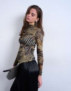 Model wearing Animal striped print ruched long sleeve top in multi