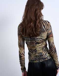 Model wearing Animal striped print ruched long sleeve top in multi