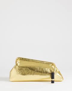 Model wearing Anna angular clutch bag in gold