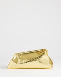 Model wearing Anna angular clutch bag in gold