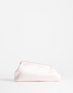 Model wearing Anna medium angular clutch bag in pale pink satin