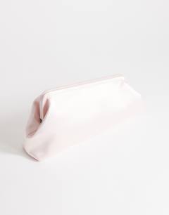 Model wearing Anna medium angular clutch bag in pale pink satin