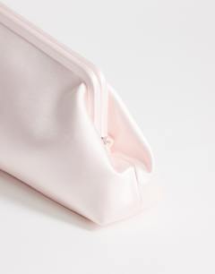 Model wearing Anna medium angular clutch bag in pale pink satin