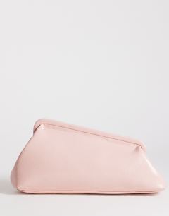 Model wearing Anna medium angular clutch bag in pink