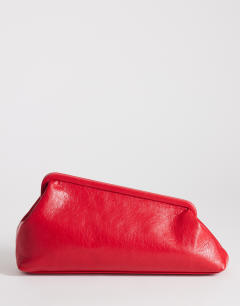 Model wearing Anna medium angular clutch bag in red