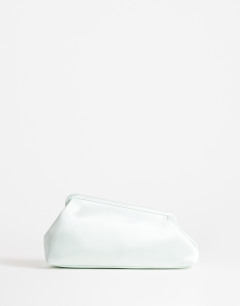 Model wearing Anna medium angular clutch bag in sage satin