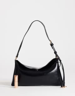 Model wearing Annabel small shoulder bag in black