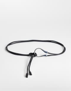 Model wearing Annie hardware tie belt in black and silver