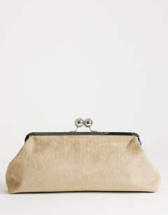 Model wearing Annie medium suedette weave clutch in taupe