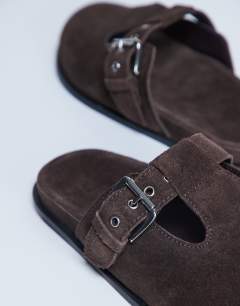 Model wearing Annie real leather buckle clog in chocolate