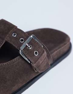 Model wearing Annie real leather buckle clog in chocolate