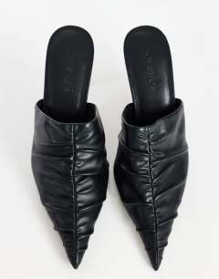 Model wearing Ansel ruched pointed mid heel court shoe in black