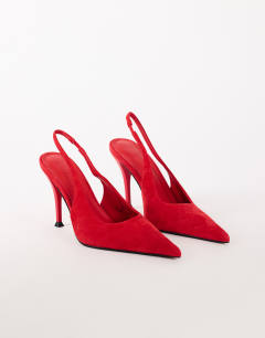 Model wearing Anya real suede sling back heeled court shoe in red