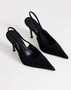 Model wearing Anya real suede sling back high heeled court shoe in black