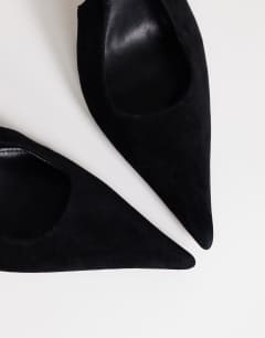 Model wearing Anya real suede sling back high heeled court shoe in black