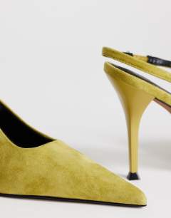 Model wearing Anya real suede sling back high heeled court shoe in olive
