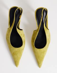 Model wearing Anya real suede sling back high heeled court shoe in olive