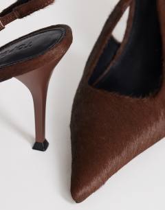 Model wearing Anya sling back high heeled court shoe in chestnut hair on real leather