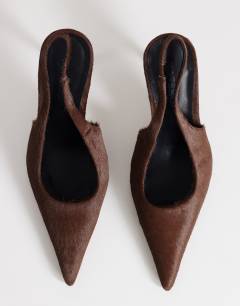 Model wearing Anya sling back high heeled court shoe in chestnut hair on real leather