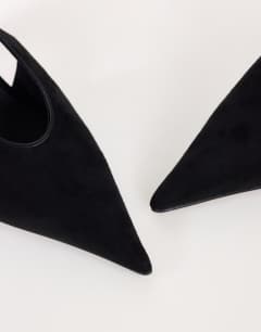 Model wearing Arabella cone heel sling back court shoe in black