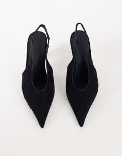 Model wearing Arabella cone heel sling back court shoe in black