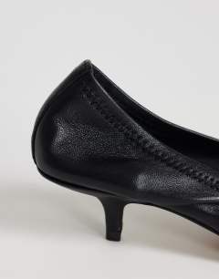 Model wearing Arizona real leather ruched kitten heel court in black