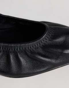 Model wearing Arizona real leather ruched kitten heel court in black
