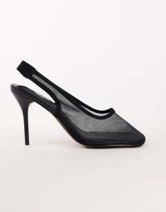 Model wearing Arrow sling back mesh heeled shoe in black