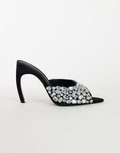 Model wearing Artemis banana heel mule with hand sewn gems in black