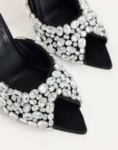 Model wearing Artemis banana heel mule with hand sewn gems in black
