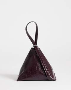 Model wearing Arthur multi wear bag in burgundy