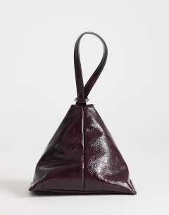 Model wearing Arthur small multi wear bag in burgundy