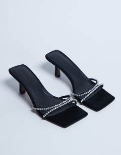 Model wearing Astrid diamante heeled mule in black hair on real leather