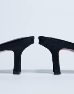 Model wearing Astrid diamante heeled mule in black hair on real leather