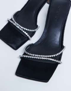 Model wearing Astrid diamante heeled mule in black real leather pony