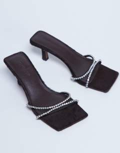 Model wearing Astrid diamante heeled mule in choc real leather pony