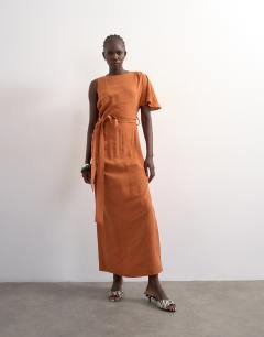 Model wearing Asym sleeve tie waist cupro maxi dress in burnt brown