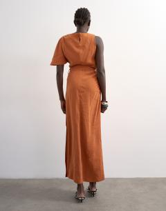 Model wearing Asym sleeve tie waist cupro maxi occasion dress in burnt brown