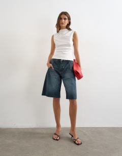 Model wearing Asymmetric button detail short sleeve in ecru