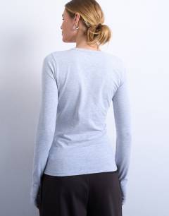 Model wearing Asymmetric button through long sleeve top in grey marl